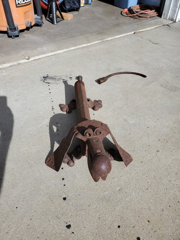 Spot the scrap-metal dog sculpture with his tail snapped off