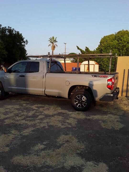 Truck fitted with a custom-built ladder rack